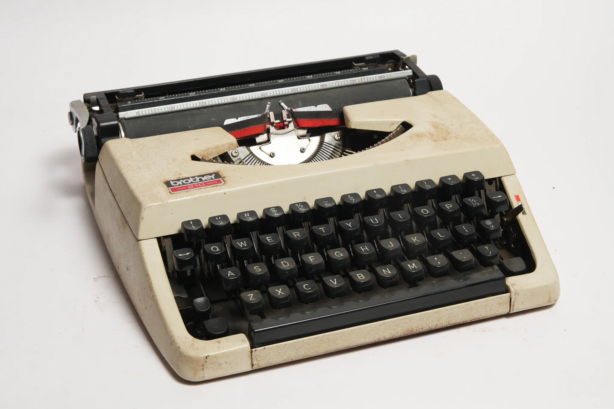 Brother 210 Portable Manual Typewriter in Cream — photograph
