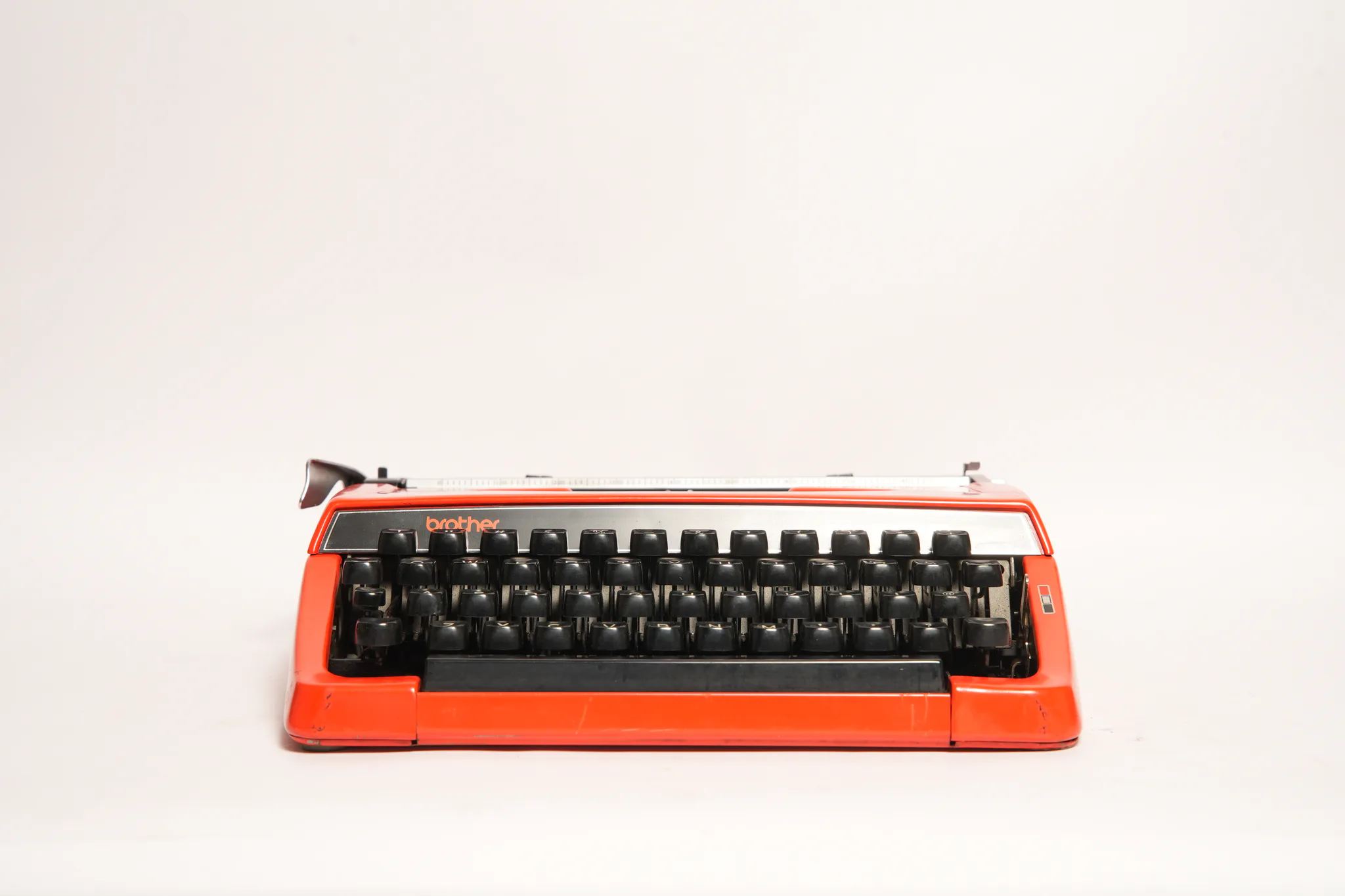 Brother Deluxe 220 Portable Scarlet Red Typewriter — photograph