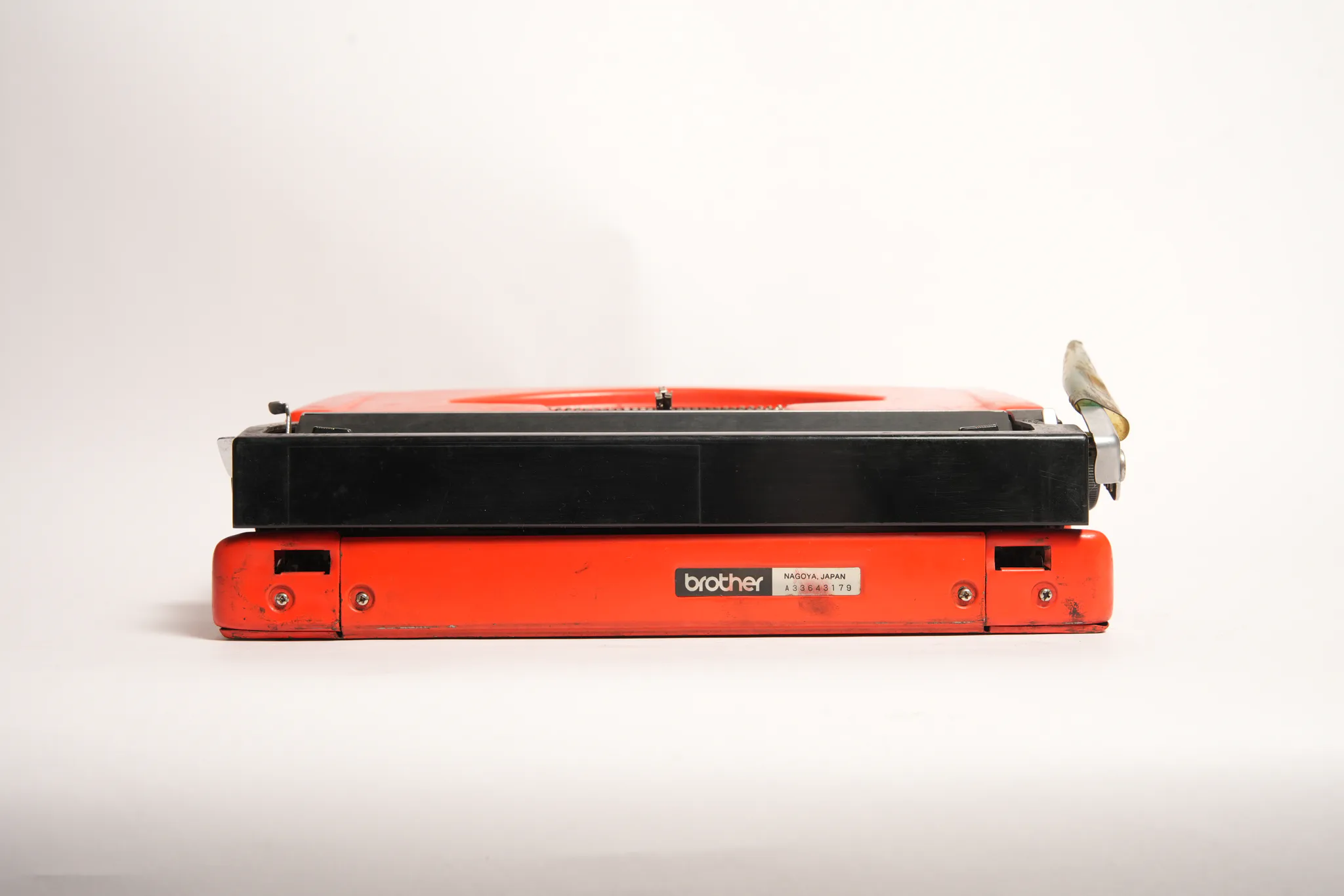Brother Deluxe 220 Vivid Red Portable Manual Typewriter — photograph