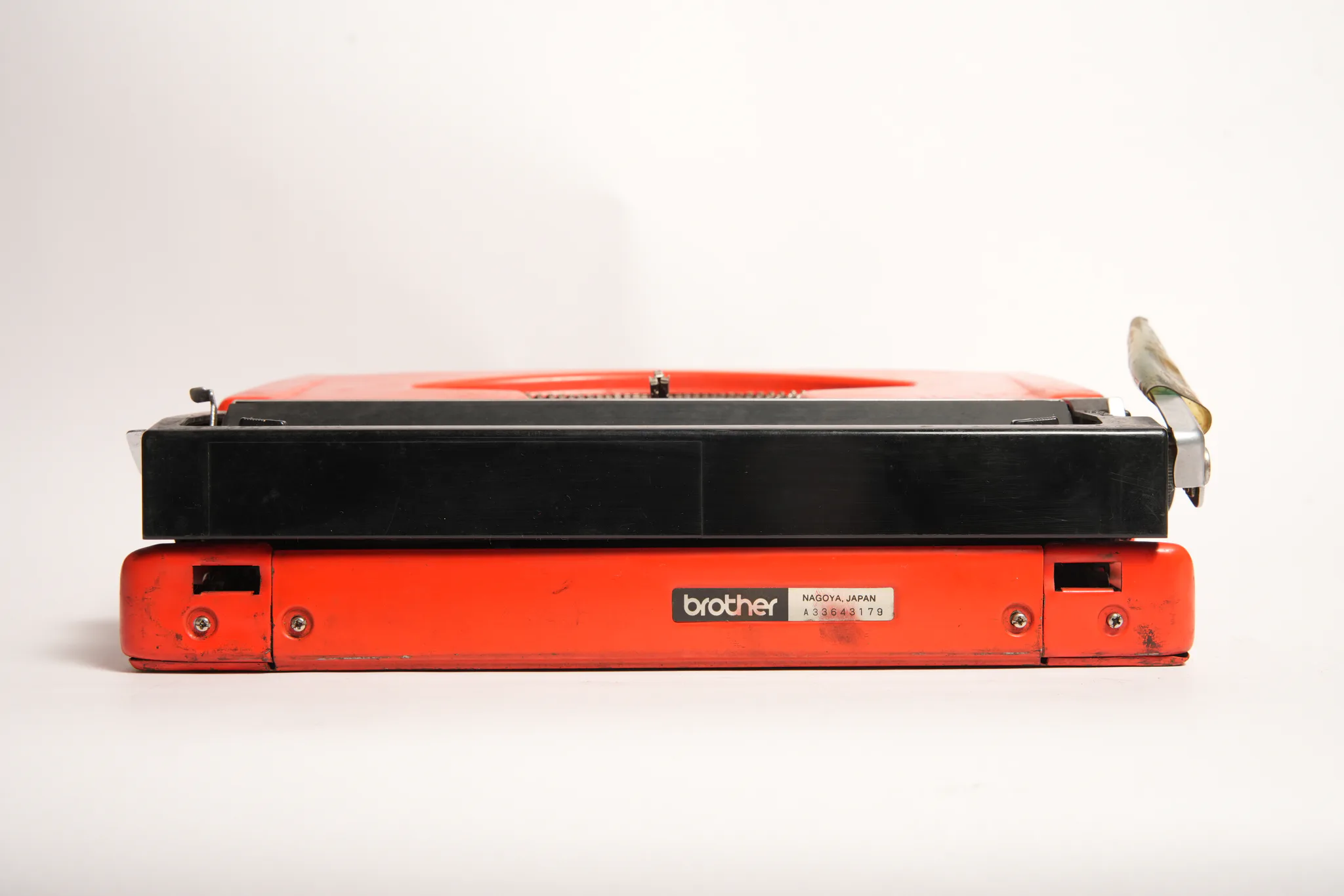 Brother Deluxe 220 Vivid Red Portable Manual Typewriter — photograph