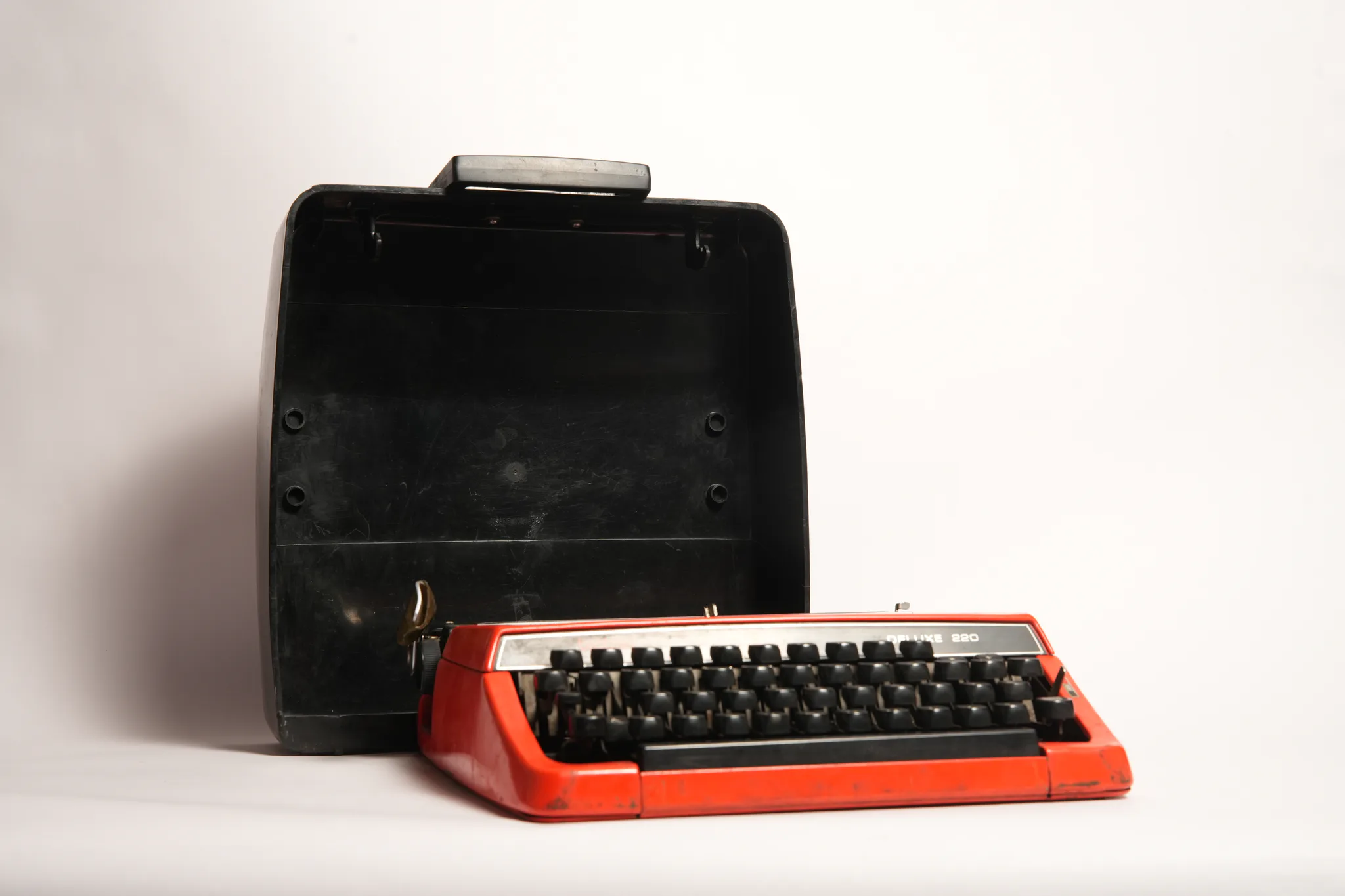 Brother Deluxe 220 Vivid Red Portable Manual Typewriter — photograph