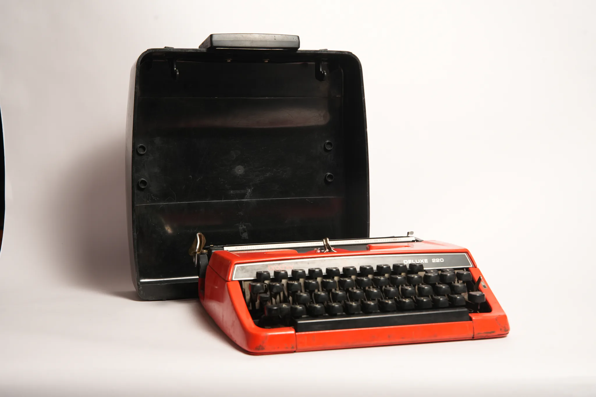 Brother Deluxe 220 Vivid Red Portable Manual Typewriter — photograph
