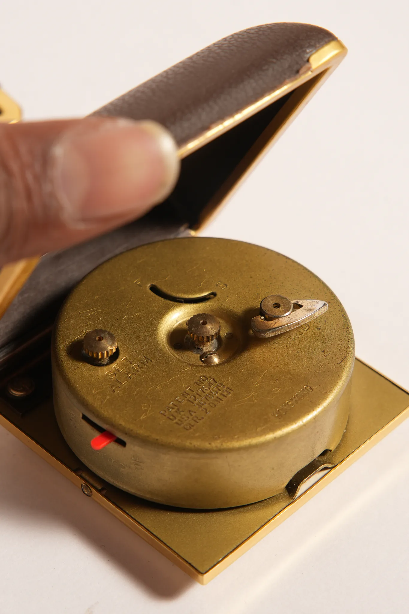 Ergo Travel Alarm Clock in Brown Leatherette Case — photograph