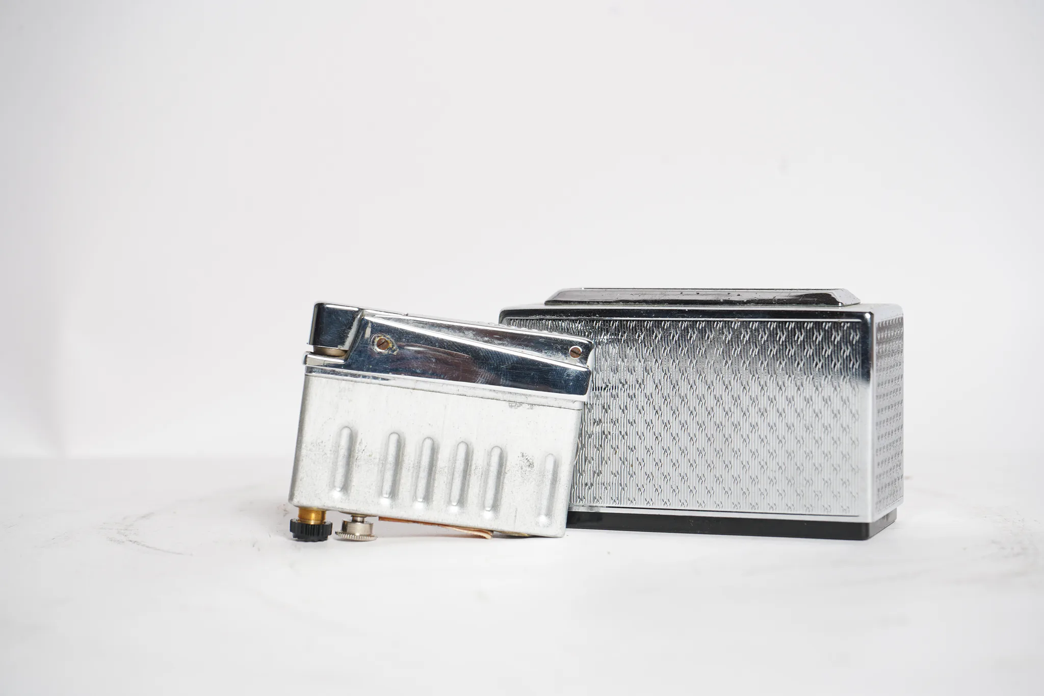 Mid-Century Guilloche Chrome Table Lighter — photograph