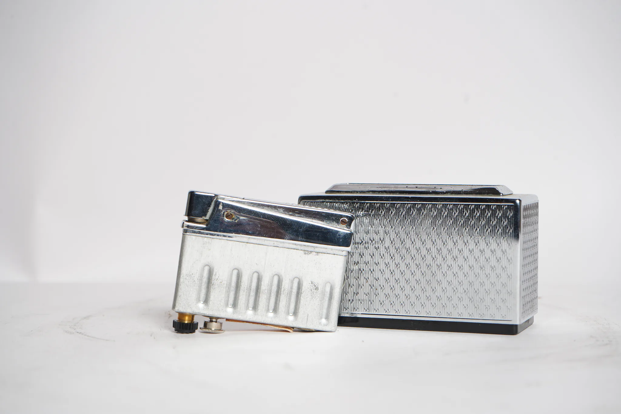Mid-Century Guilloche Chrome Table Lighter — photograph