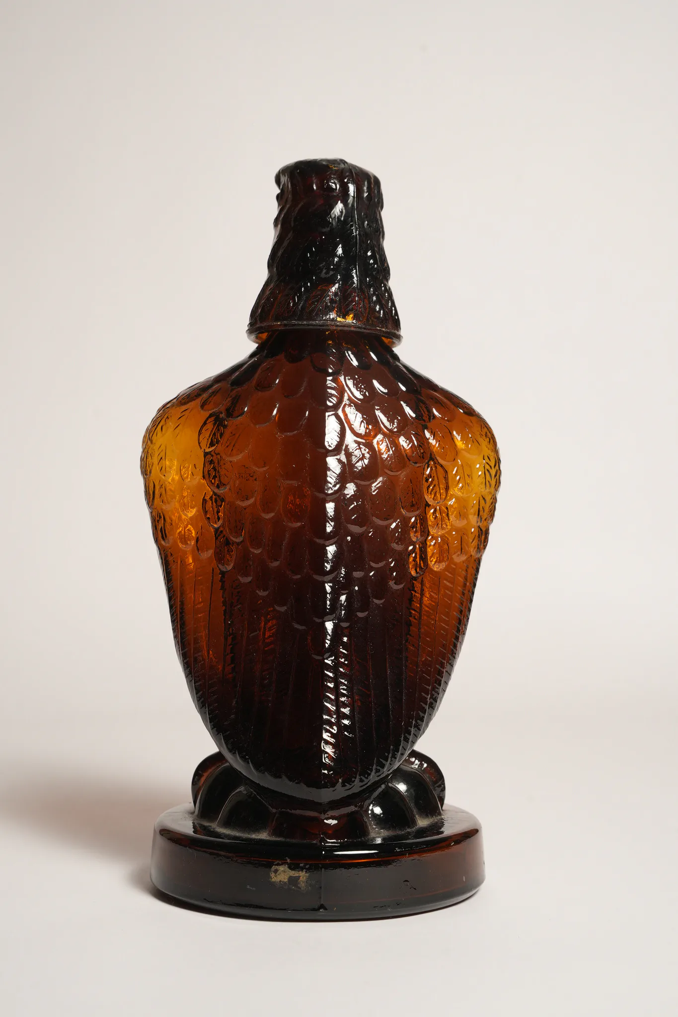 Mohan Meakin Amber Glass Eagle Decanter Bottle — photograph 2