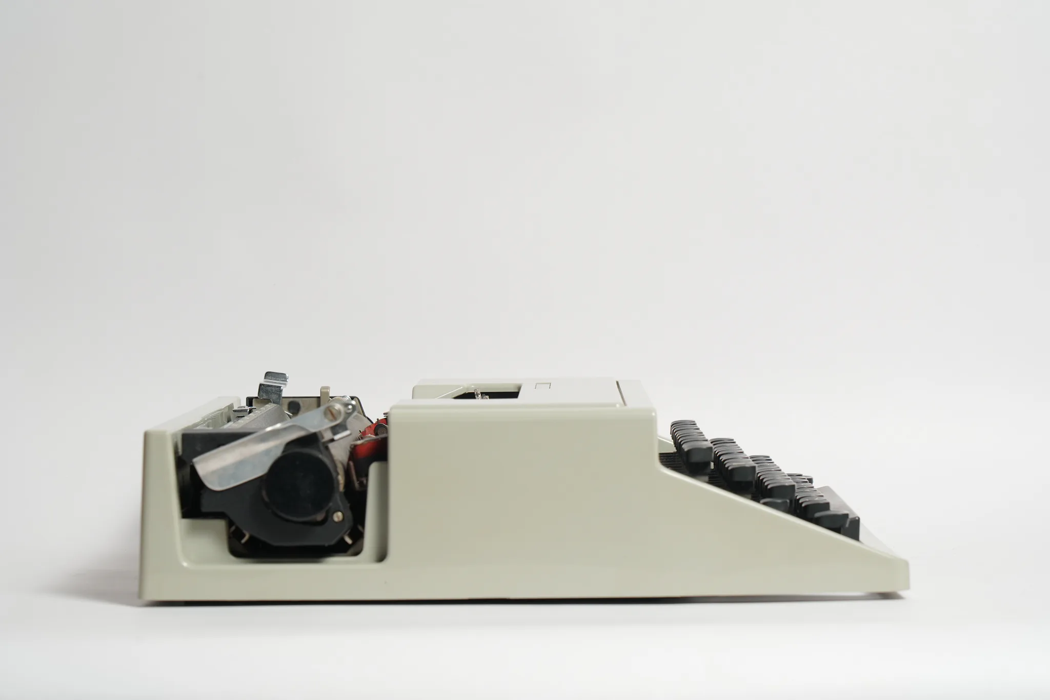 Olivetti Dora Typewriter with Teal Travel Case — photograph