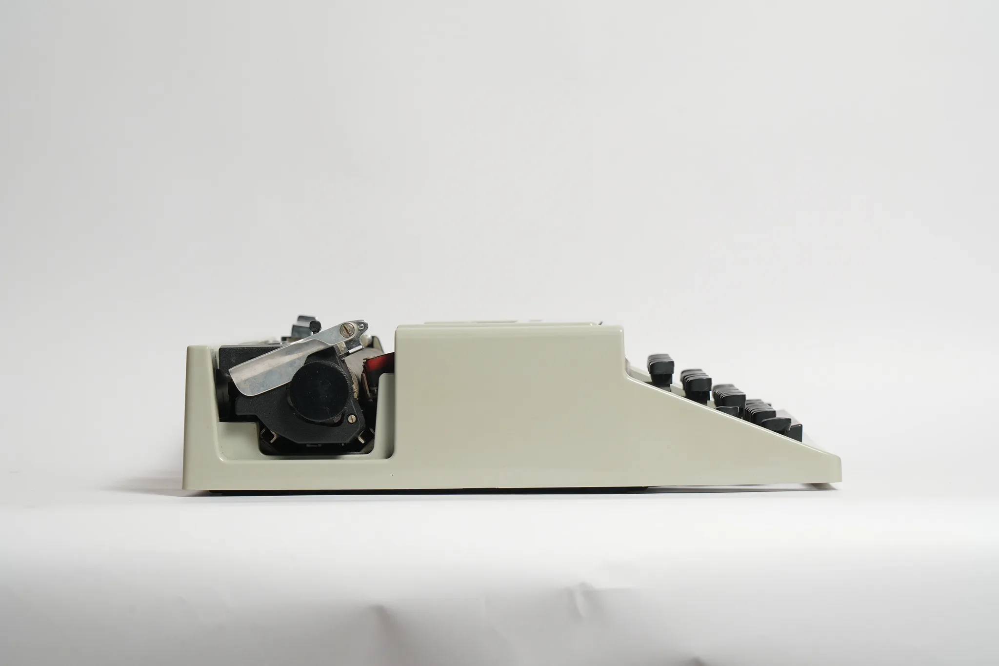 Olivetti Dora Typewriter with Teal Travel Case — photograph