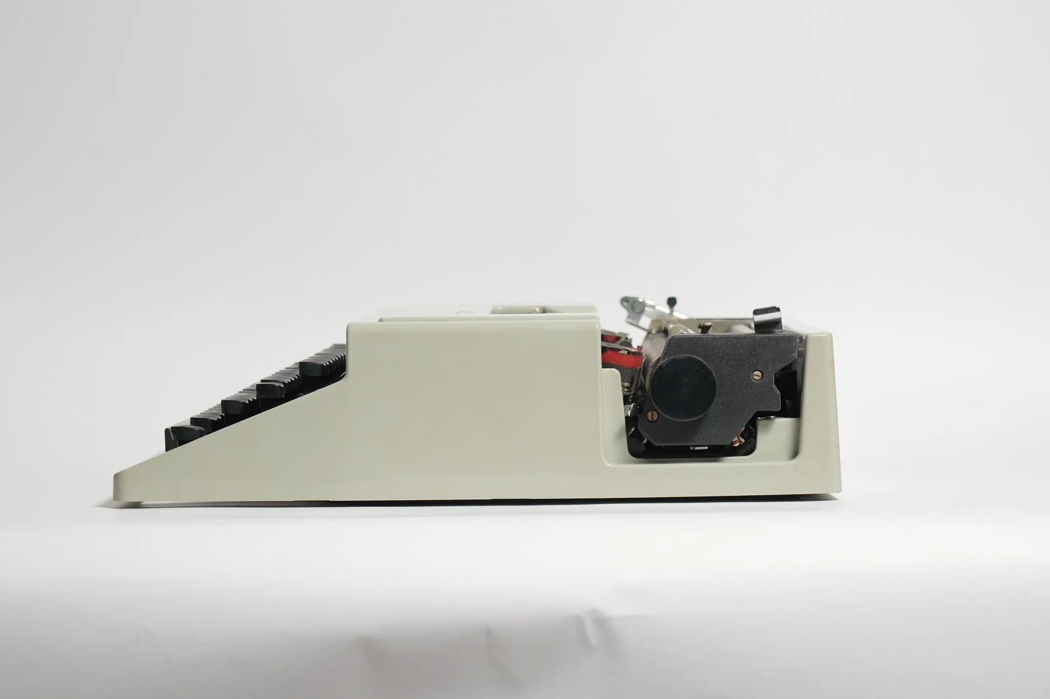 Olivetti Dora Typewriter with Teal Travel Case — photograph