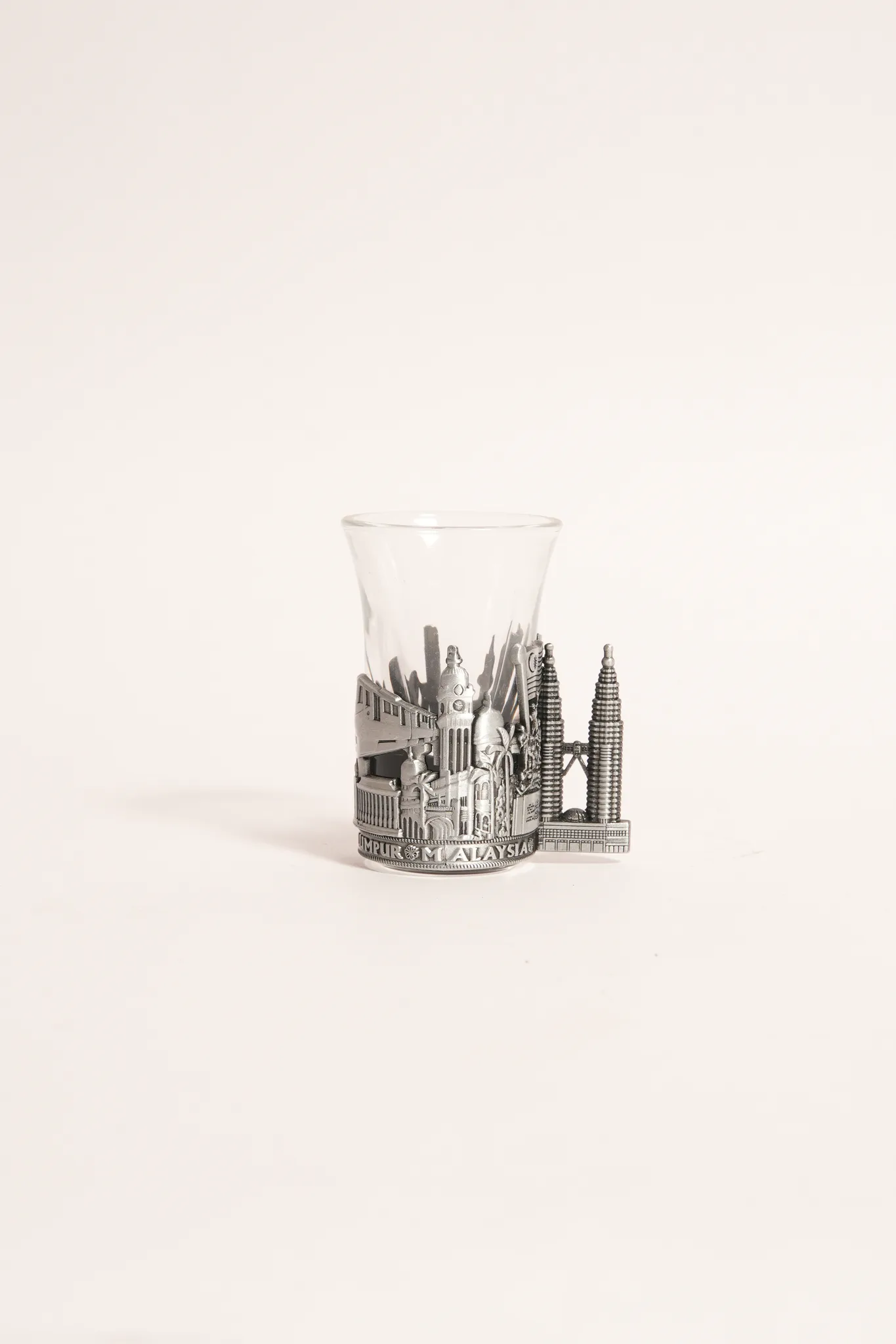 Royal Pewter Kuala Lumpur Relief Emblem Glass Cup — photograph