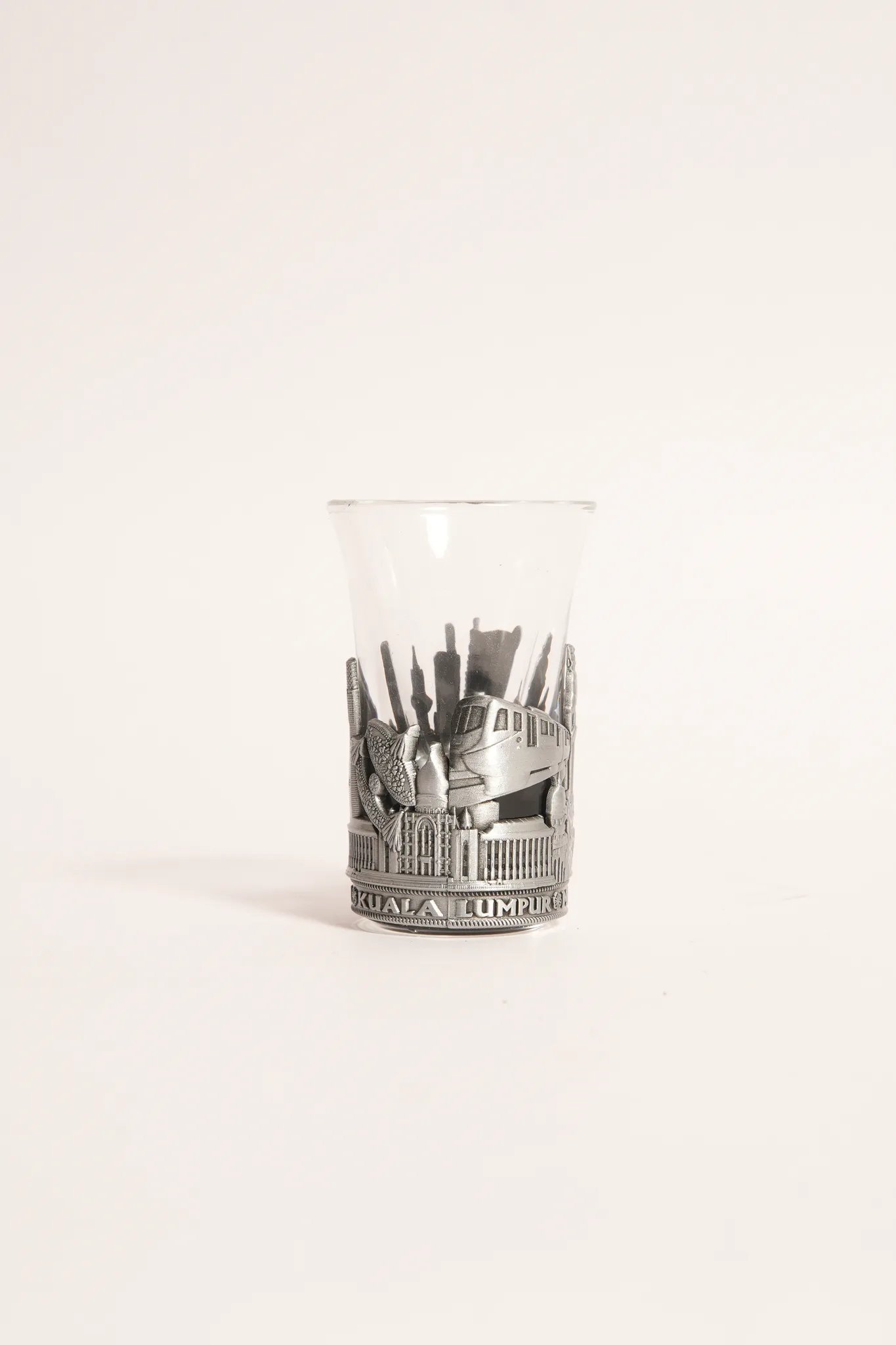 Royal Pewter Kuala Lumpur Relief Emblem Glass Cup — photograph