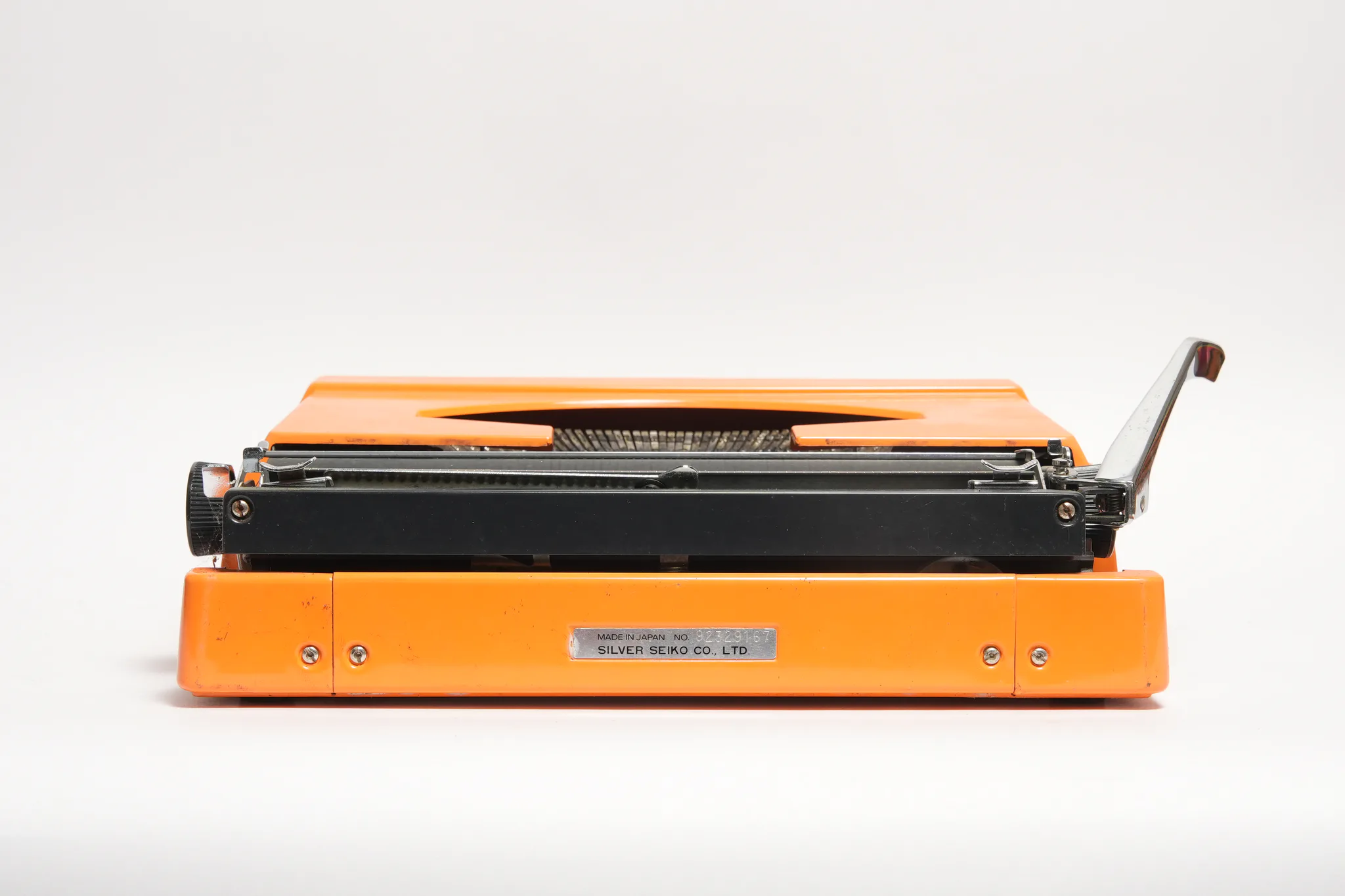 Silver-Reed 200 Portable Orange Typewriter — photograph
