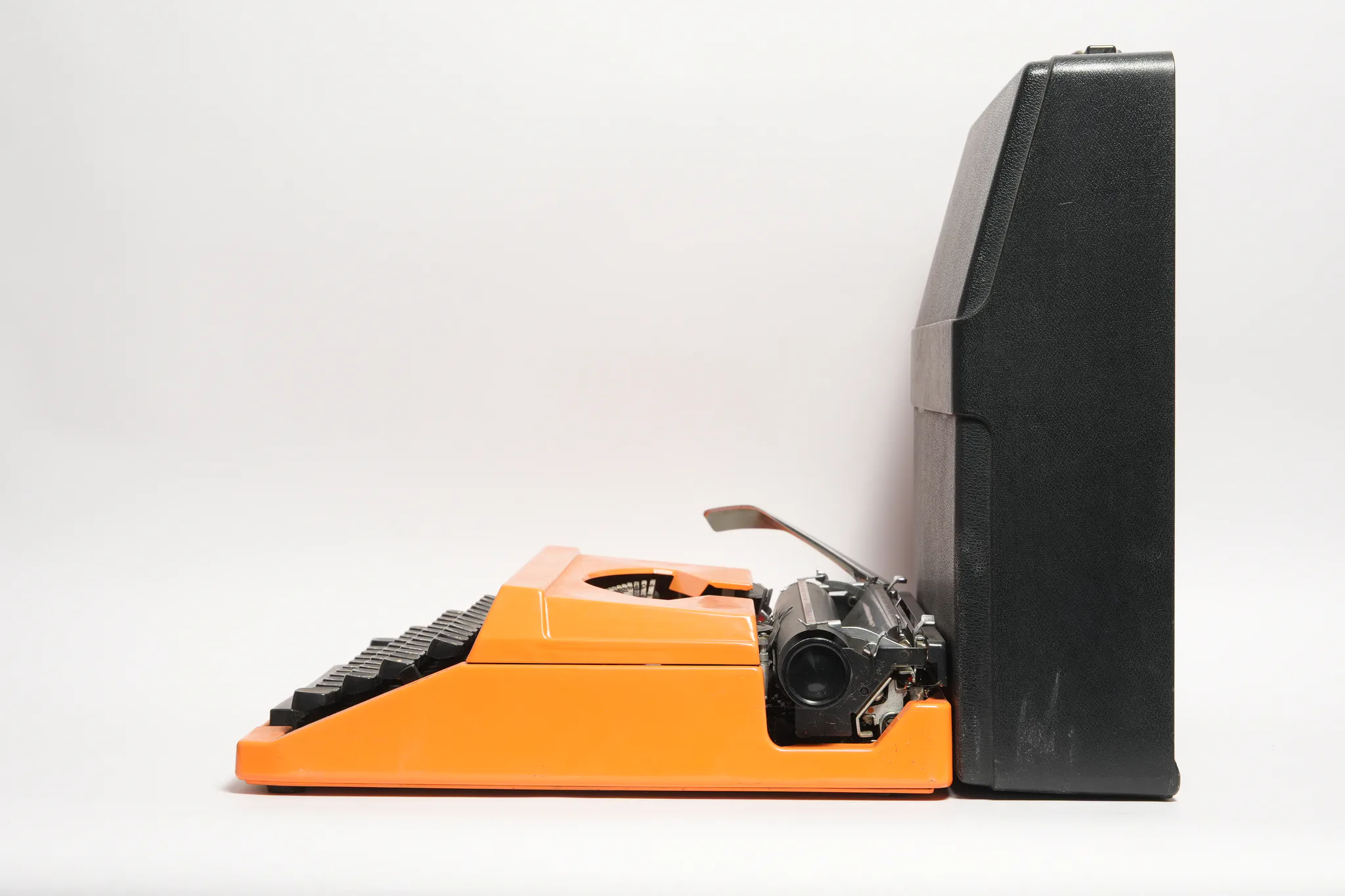 Silver-Reed 200 Portable Orange Typewriter — photograph