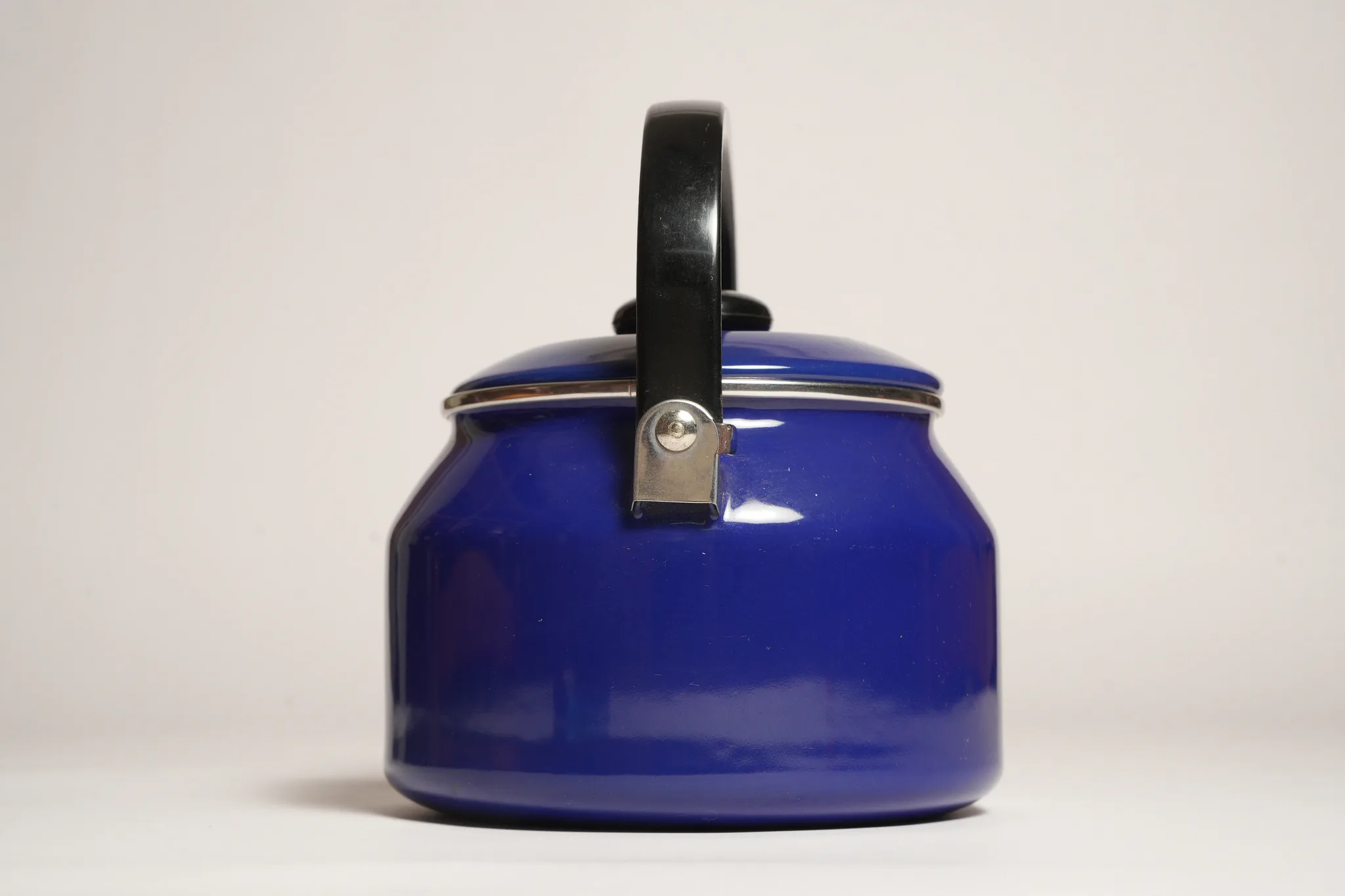 Vintage Blue Enamel Teapot with Black Handle — photograph