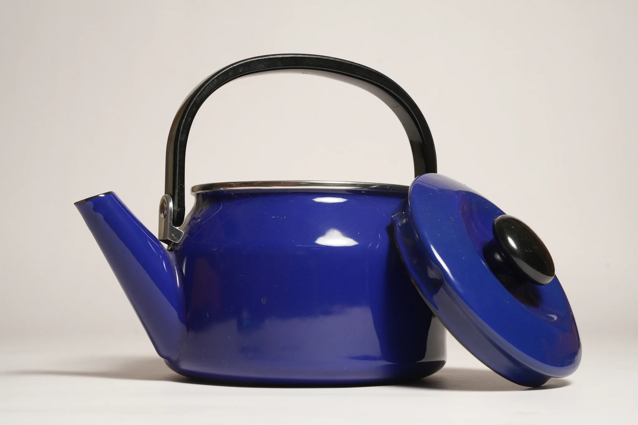 Vintage Blue Enamel Teapot with Black Handle — photograph