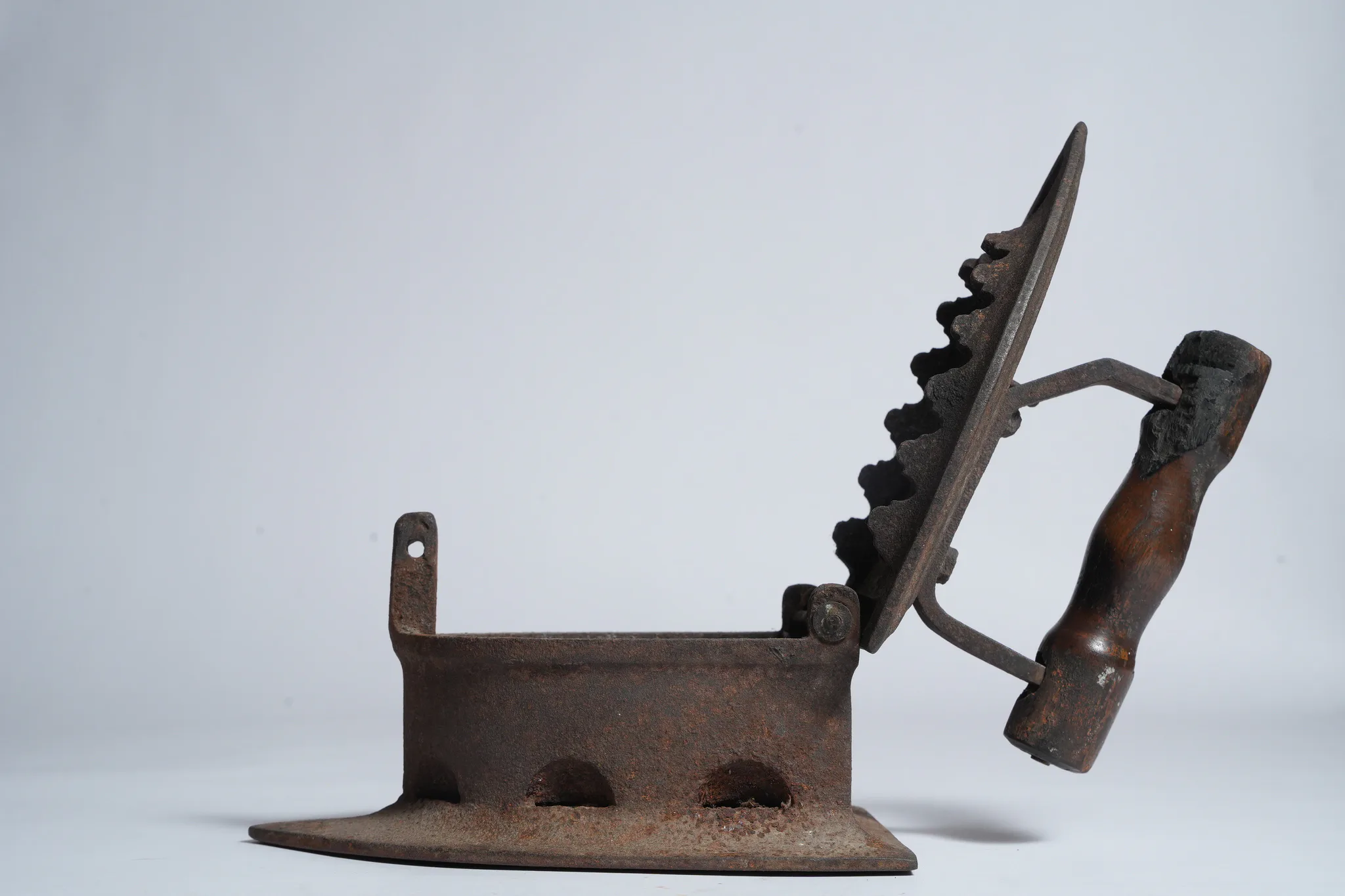 Vintage Cast Iron Charcoal Flatiron (Antique Laundry Tool) — photograph