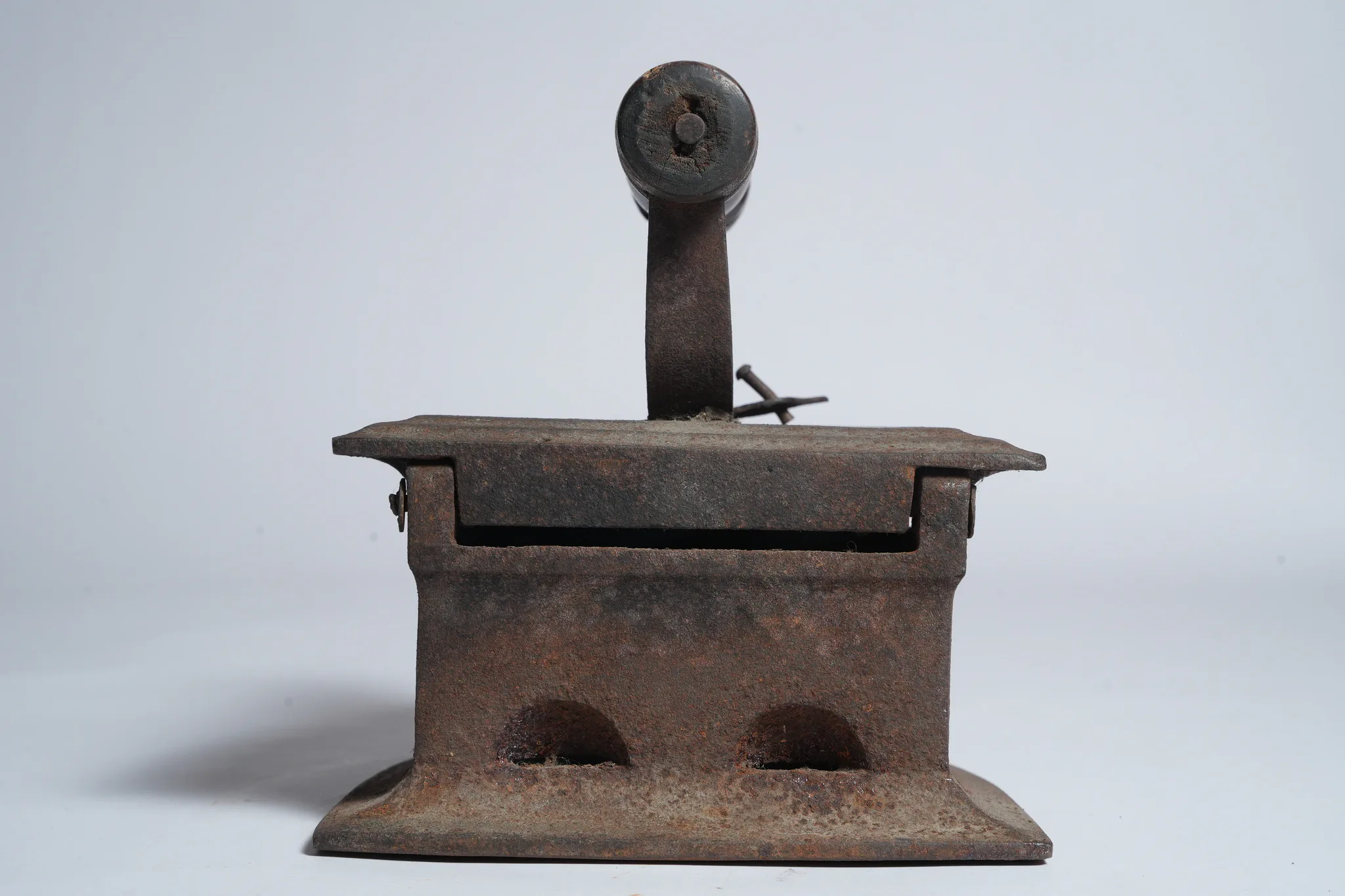Vintage Cast Iron Charcoal Flatiron (Antique Laundry Tool) — photograph