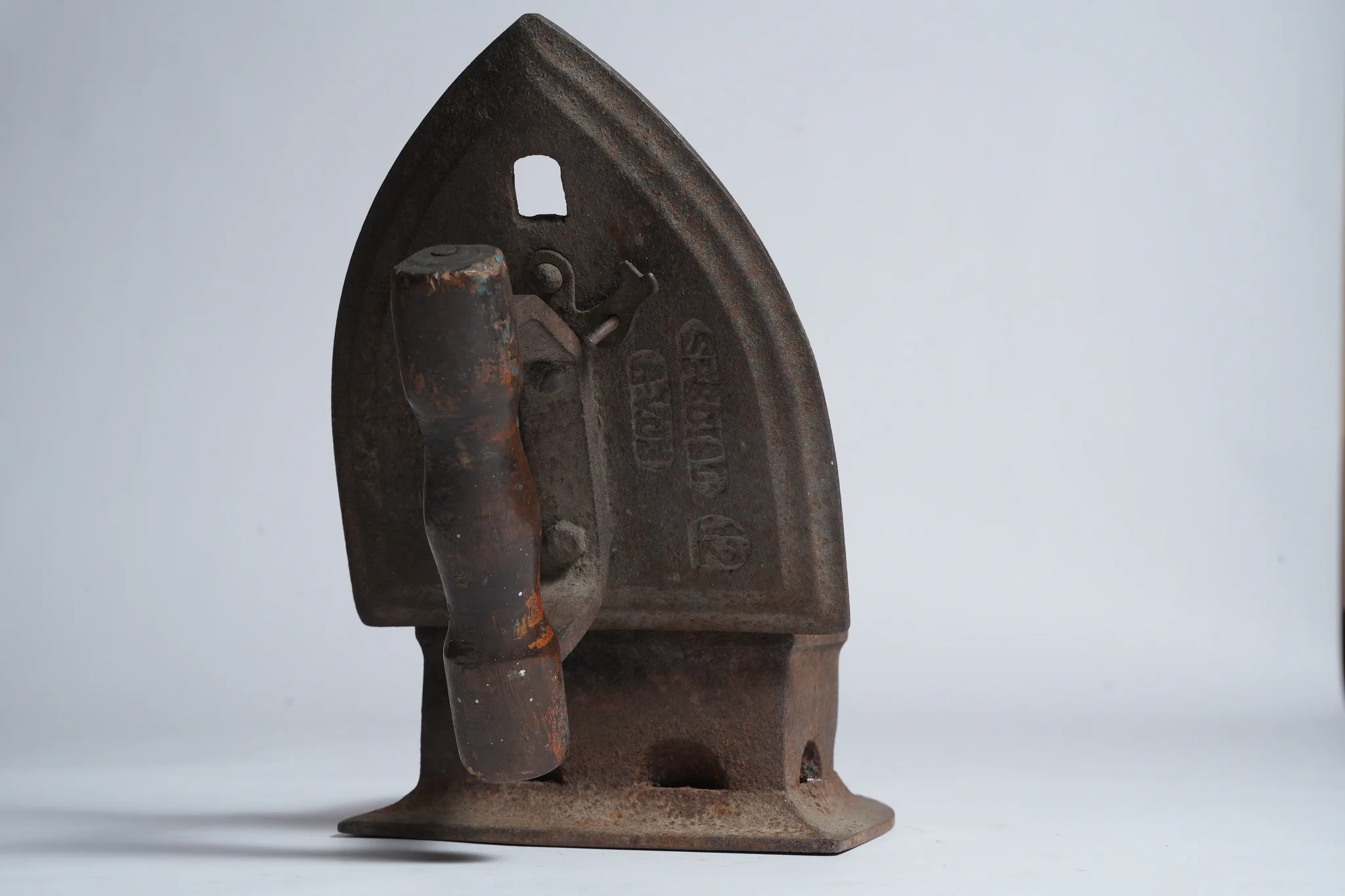 Vintage Cast Iron Charcoal Flatiron (Antique Laundry Tool) — photograph