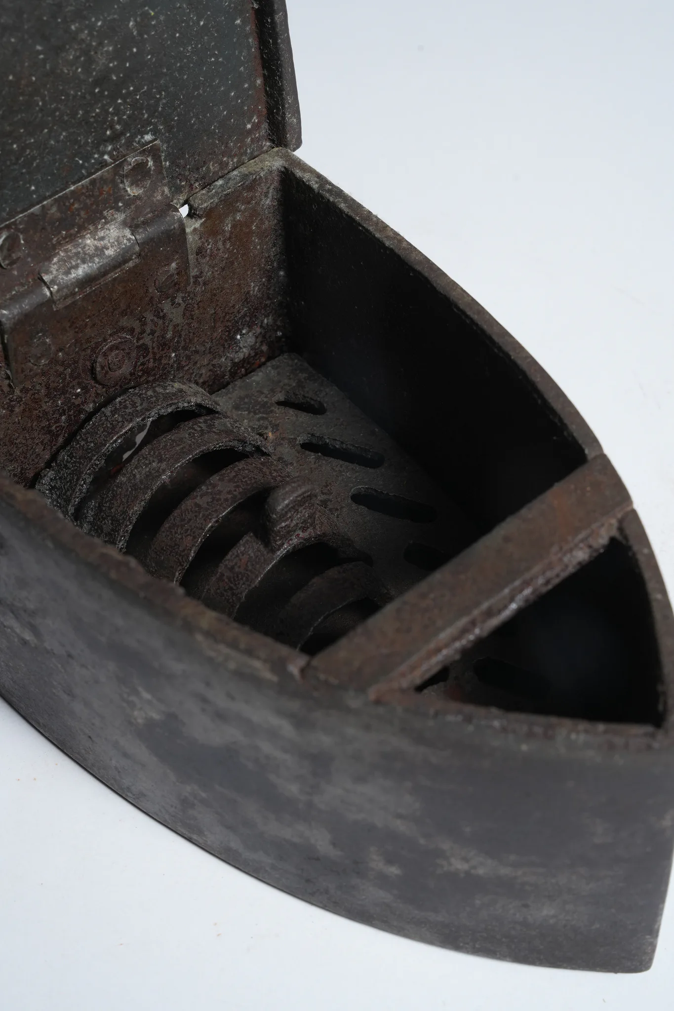 Vintage Cast Iron Charcoal Flatiron with Wooden Handle — photograph