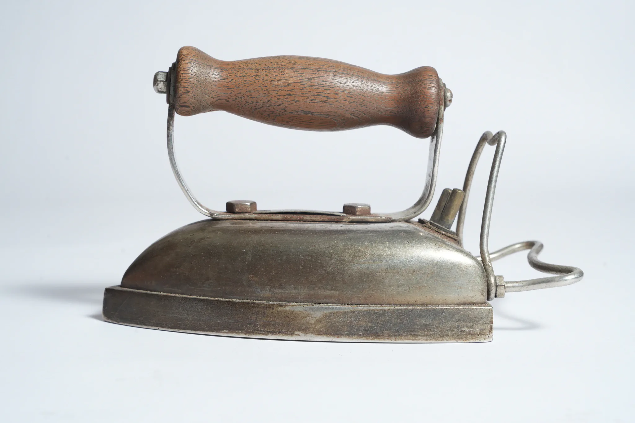 Vintage Electric Flat Iron with Wooden Handle — photograph