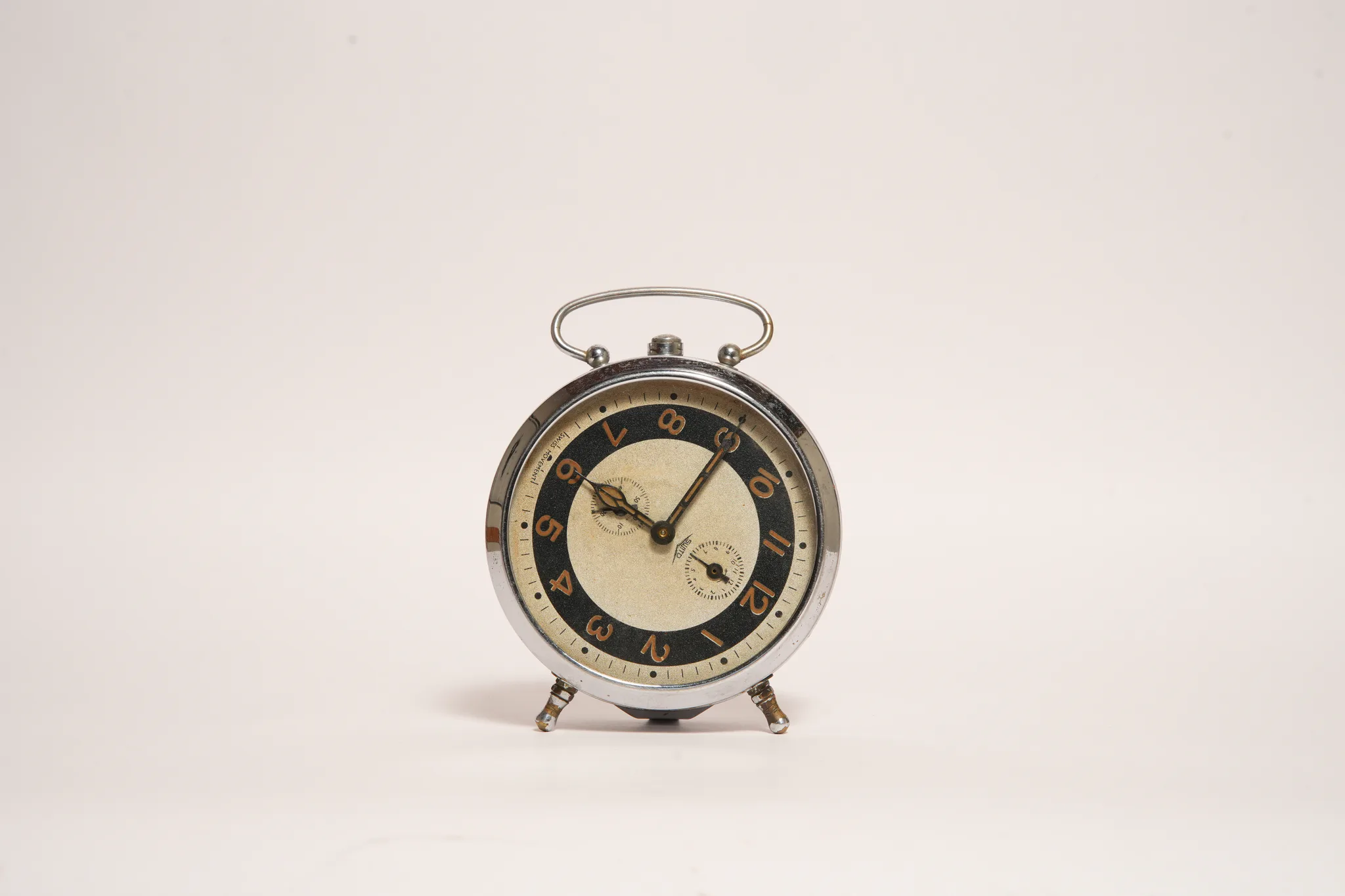 Vintage Swiss Movement Two-Tone Alarm Clock — photograph