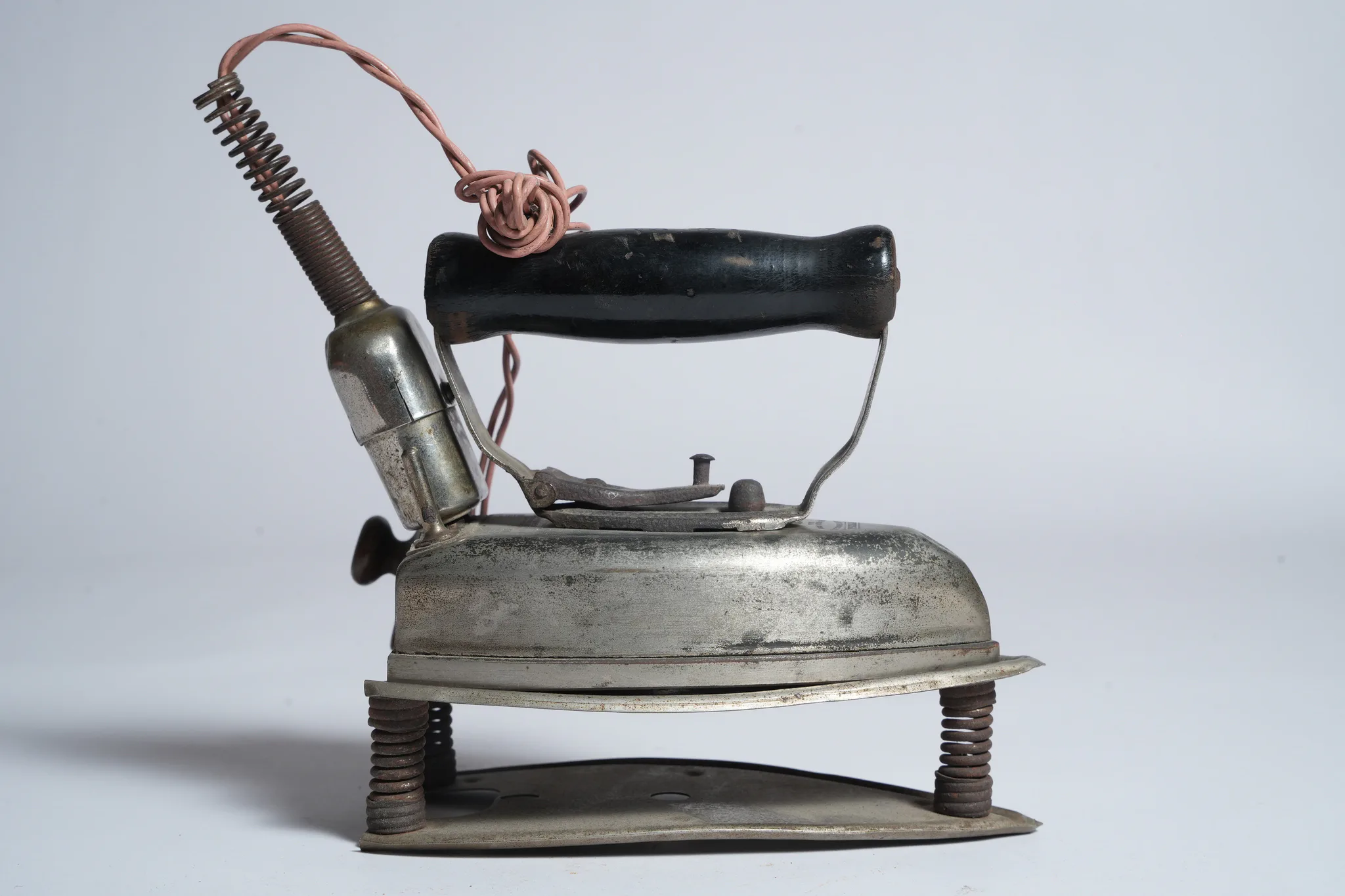 Vintage Universal Electric Iron and Curling Iron Heater Set — photograph