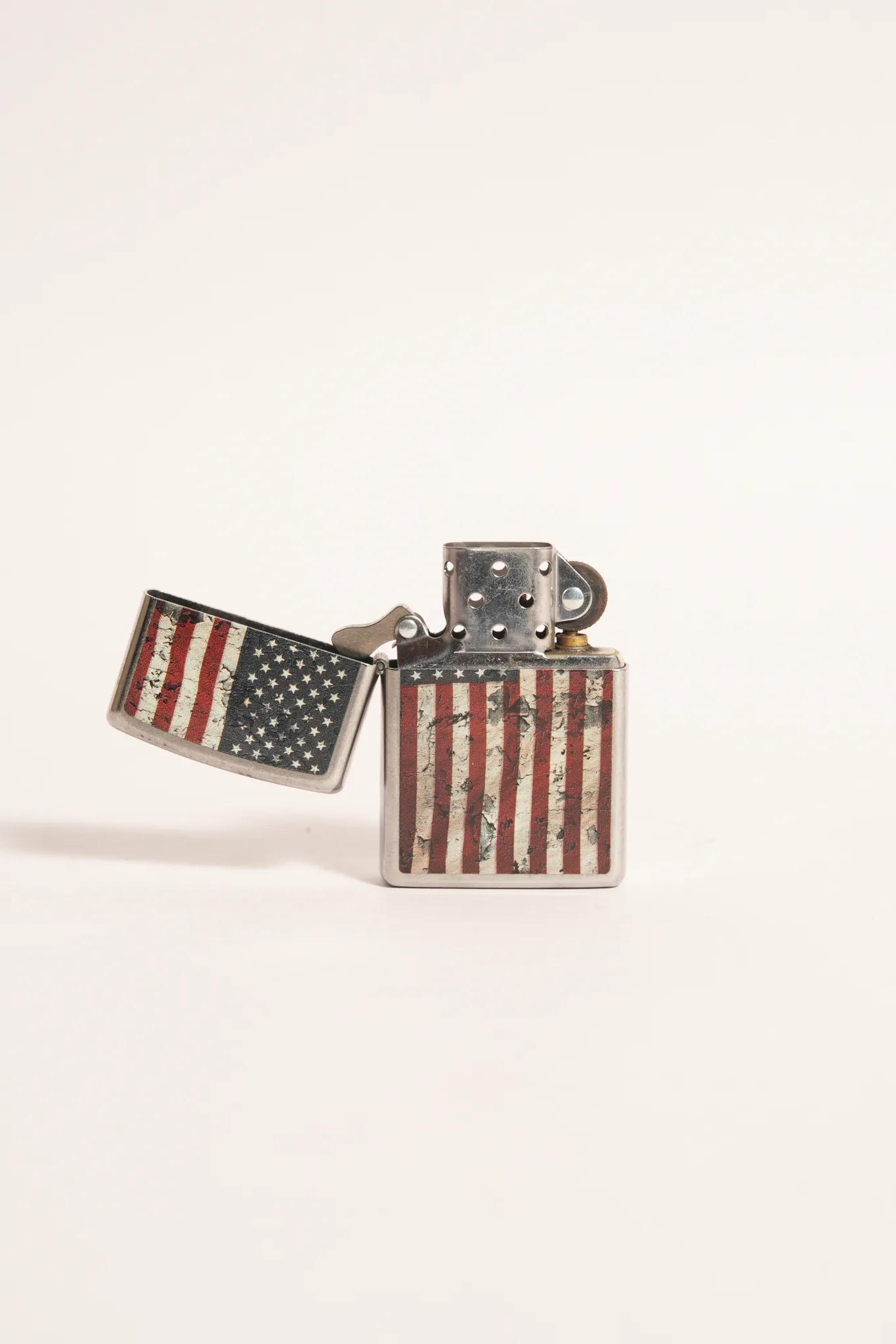 Vintage Zippo Distressed Stars & Stripes Lighter — photograph