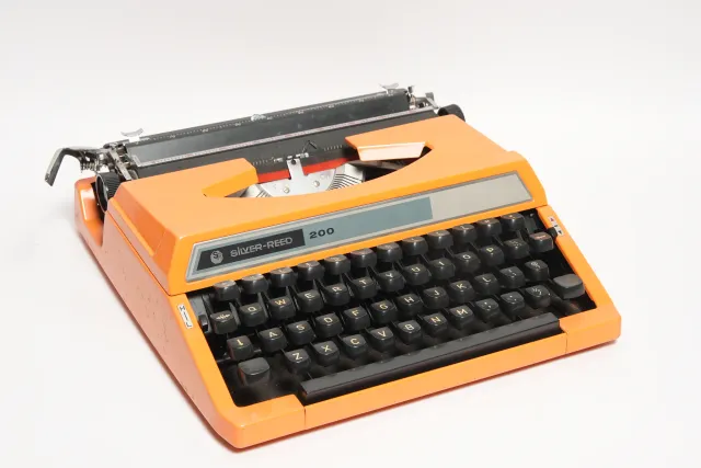 Silver-Reed 200 Portable Orange Typewriter